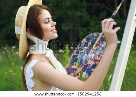 woman paints a paint style picture