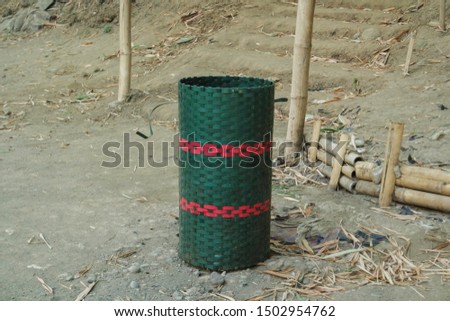 
trash can made of woven bamboo