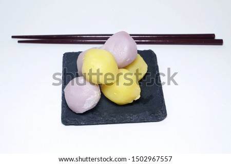 A high key photo of "songpyeon" or half-moon shaped rice cakes serve during Chuseok festival. Songpyeon is a traditional Korean food made of rice powder stuffed with sweet feelings. 