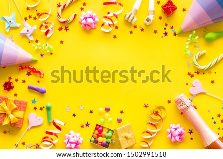 party time frame with decorations on yellow background top view mock up