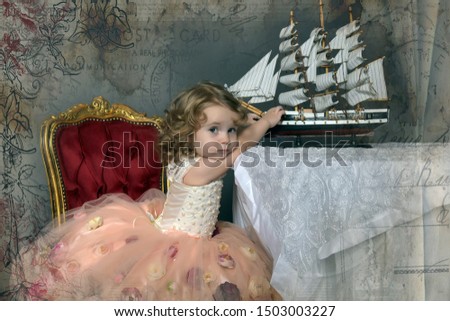 charming little girl in elegant white with a pink dress sitting at a table with a toy sailboat, retro style photo