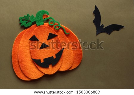 pumpkin and bat on halloween background. Space for text.