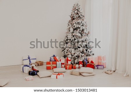 Interior with white Christmas tree for the new year with gifts for the holiday