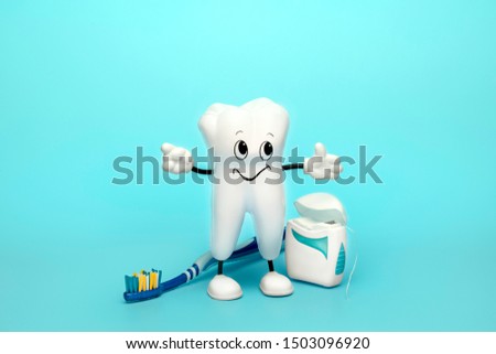 Dentist background with healthy tooth toothbrush and floss. Dental care concept.