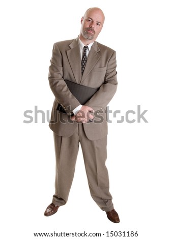 Stock photo of a well dressed businessman holding a notebook.