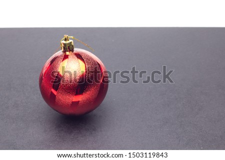 Red balls, Christmas balls and tinsel to decorate Christmas tree and house decoration; Christmas parties.Christmas decoration