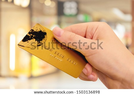 hand holding a credit card isolated on white background.