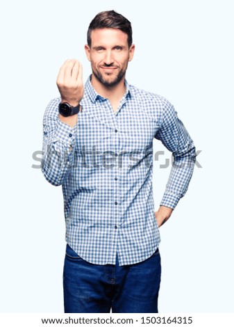 Handsome business man with blue eyes Doing Italian gesture with hand and fingers confident expression