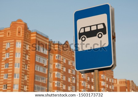 A small bus stop with a sign. Closeup photo