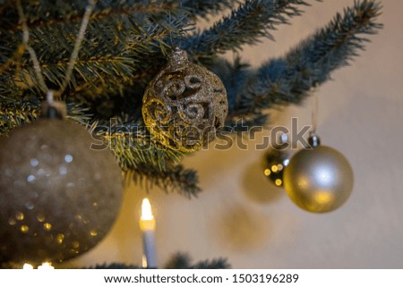German Christmas, Various Christmas tree ornaments with focus on a Christmas tree balls.It is pictured wood and glass Christmas tree ornament