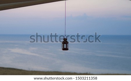 Sunset picture of a lamp and ocean