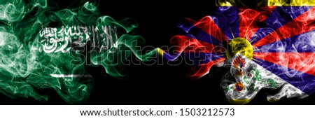 Saudi Arabia Kingdom vs Tibet, Tibetan smoky mystic flags placed side by side. Thick colored silky smoke flags of Arabic, Arabian and Tibet, Tibetan