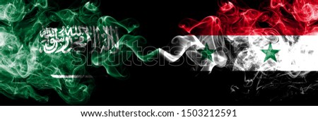 Saudi Arabia Kingdom vs Syria, Syrian smoky mystic flags placed side by side. Thick colored silky smoke flags of Arabic, Arabian and Syria, Syrian