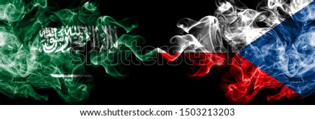 Saudi Arabia Kingdom vs Czech Republic smoky mystic flags placed side by side. Thick colored silky smoke flags of Arabic, Arabian and Czech Republic