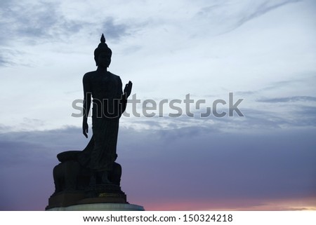 Silhouette of buddha statue on sunset in Phutthamonthon park, Thailand