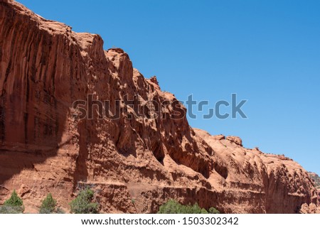 Low angle landscape of red stone cliff along the Burr Trail Road in Grand Escalante National Monument