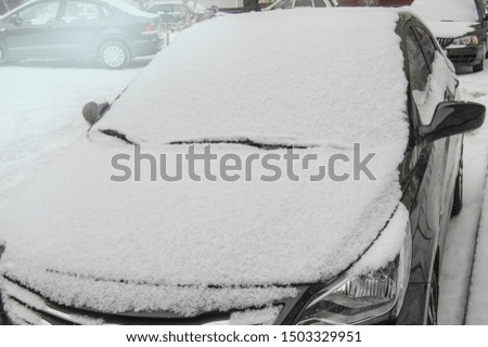 Windshield of the car swept by snow, winter background outdoors