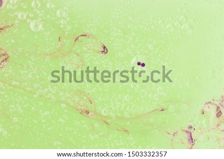Green background with abstract oil eyes
