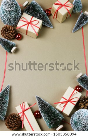 Christmas background and decorations with ribbon frame on brown board, Top view.