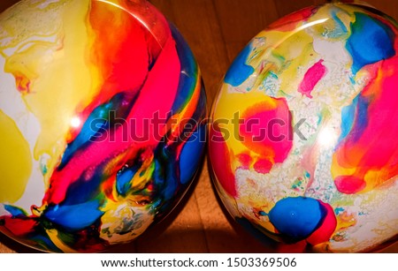 Colored round balloons lie side by side