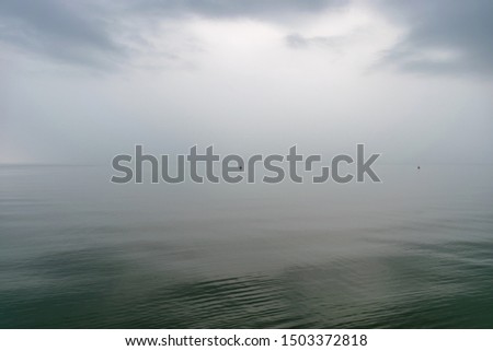 abstract picture with tranquility at sea, calm water, unspoiled horizon