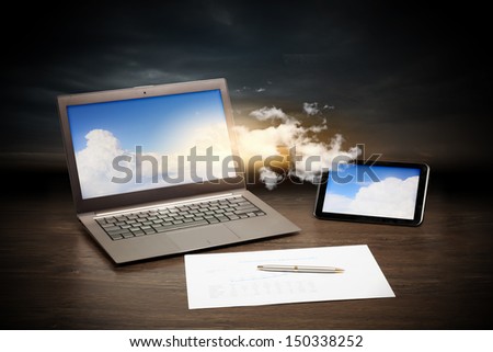 Image of business workplace with laptop, ipad, cup of coffee
