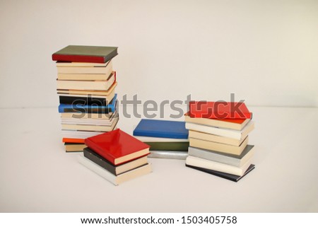Stack of books on white background
