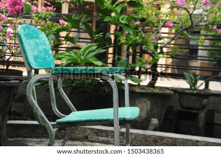 
green chair in front of the house