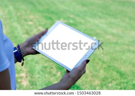 Digital tablet in girl hands 