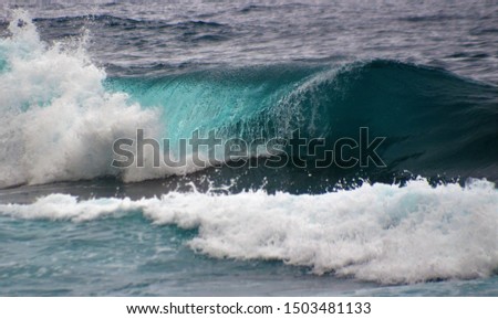 
Ocean wave breaking. Beautiful play of colors