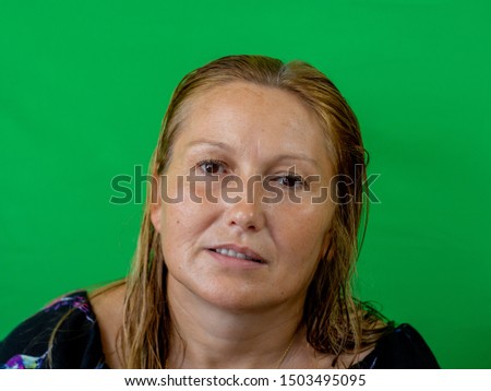 Portrait of woman on green background