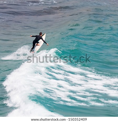 surfer riding alone on a windy day