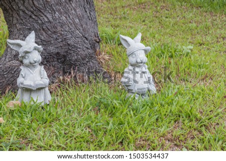 Rabbit sculptures in garden house decoration.