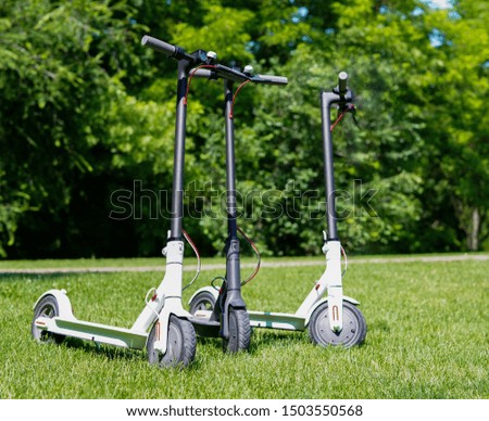 Three new electric scooters staying in park for rent