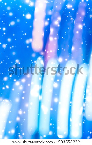 Christmas lights, New Years Eve card and cosmic texture concept - Winter holiday abstract background, glowing snow and magic sparkling shiny glitter