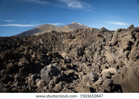 Close view of solidified AA lava field with Teide and Pico Viejo volcano in the background at Teide National park in Tenerife 
