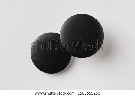 Design concept - top view of 2 black badge on white background for mockup, it's real photo, not 3D render