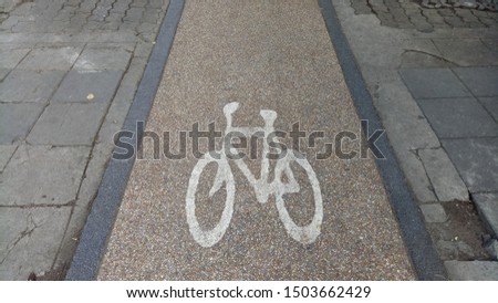 The picture of a bicycle on the road surface is a symbol used in traffic to indicate that it is a bicycle path.