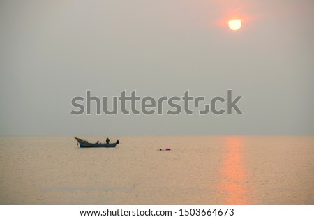 Local fishing boats fish in the sea, morning sunrise with beautiful light , Fishermen in Songkhla, Thailand