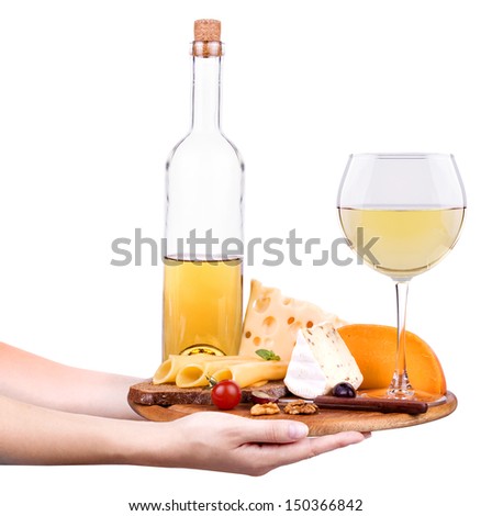waiter hand with wooden board including a wine,bread,cheese and grapes