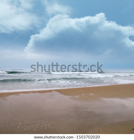seascape image of waves on sea over stormy sky