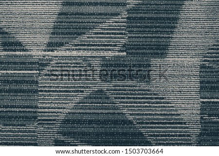 Horizontal striped patterned carpet with noir effects. 