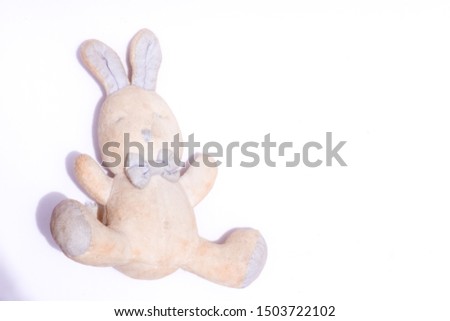 old rabbit doll is on white background. 