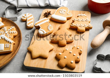 Tasty homemade Christmas cookies on grey table
