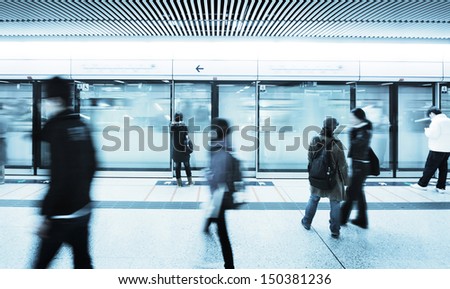 blur people walk at subway station