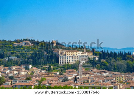 Cityscape at Verona, Italy; with a hill at the background. 