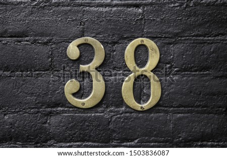 Number thirty eight, detail of even number, street address