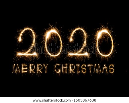 Happy New Year 2020. Creative text Happy New Year 2020 written sparkling sparklers isolated on black background for design，Merry Christmas
