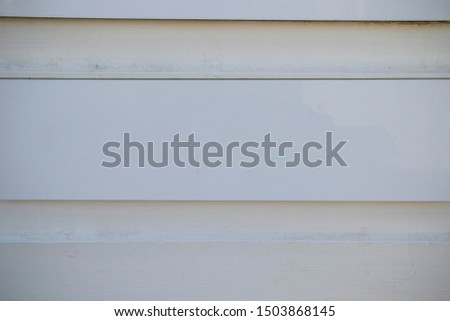 blank sign boards attached on a white wooden wall. Mock up, template, education, advertisement and concept. Spaces for your text.
