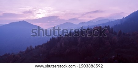 Carpatian village mountains at the fog  Royalty-Free Stock Photo #1503886592